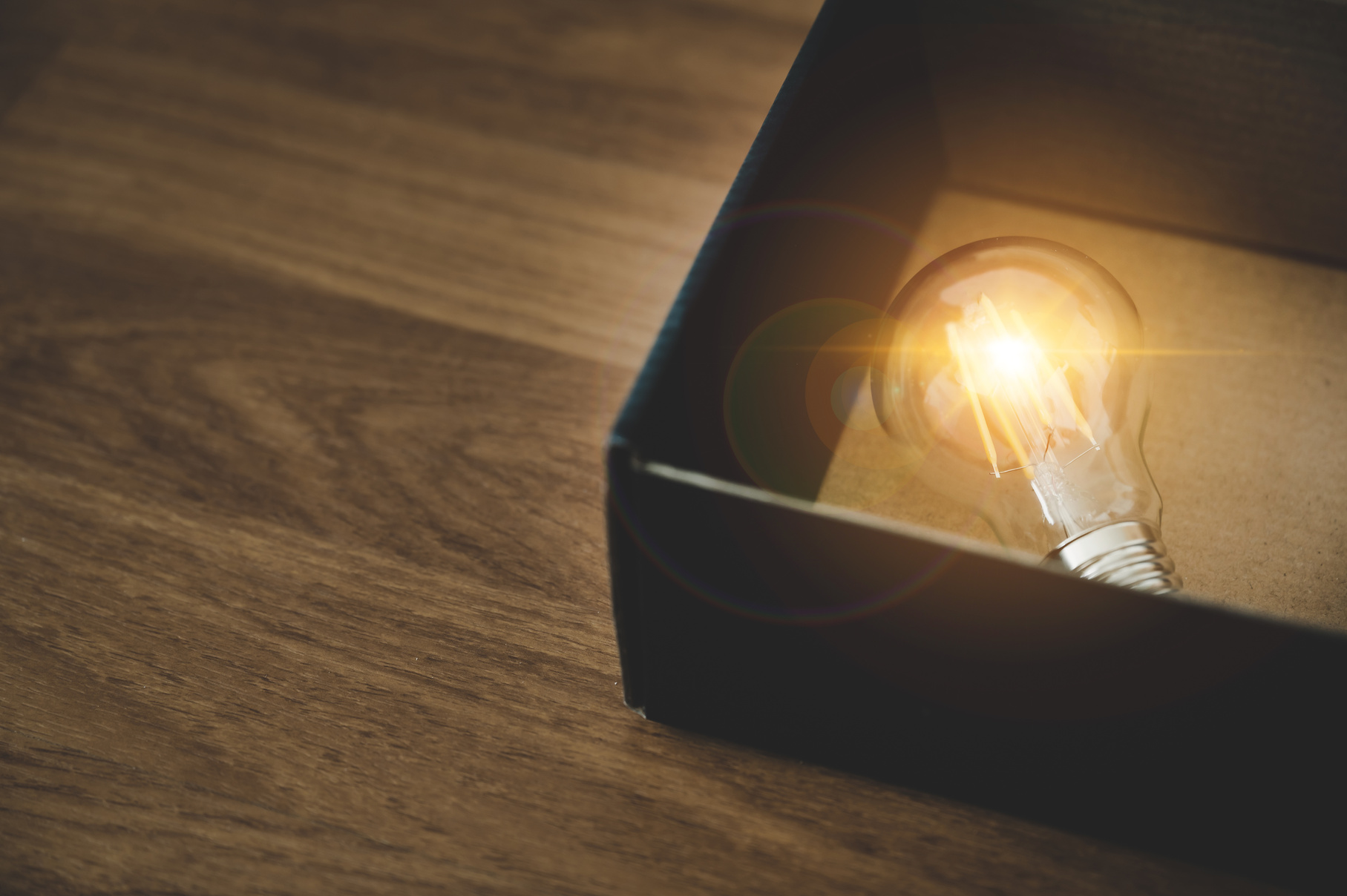 Creative Idea Concept Light Bulb in the Black Box